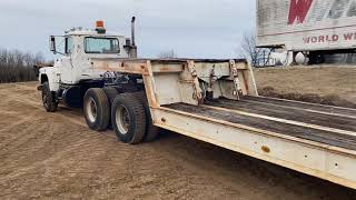 Lowboy Mack semi. Solid truck, runs well. Lowboy Trailer FOR SALE www.hiattauctionservice.hibid.com