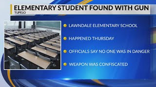 School officials: Elementary school student found with gun