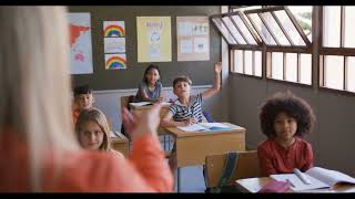 School Boy Raising hand in the Classroom Stock Video | Back view copyright free video | Pixadisc