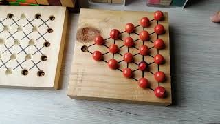 How to Solve the 21-Hole Triangle Peg Solitaire Puzzle