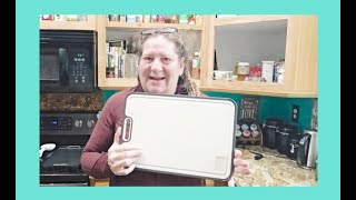 You'll love using this dual sided cutting board! Titanium and wheat straw.