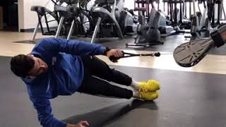 Side plank with single arm cable row