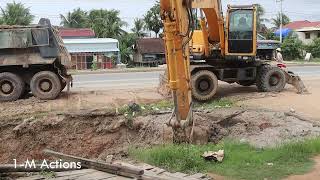 HYUNDAI 210W AND DUMP TRUCK WORK HARD ON THE RAOD /Y12
