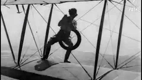 Gladys Ingle changes wheel in mid air