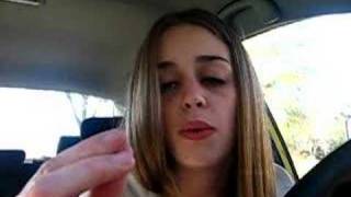 Girl in car amusing herself