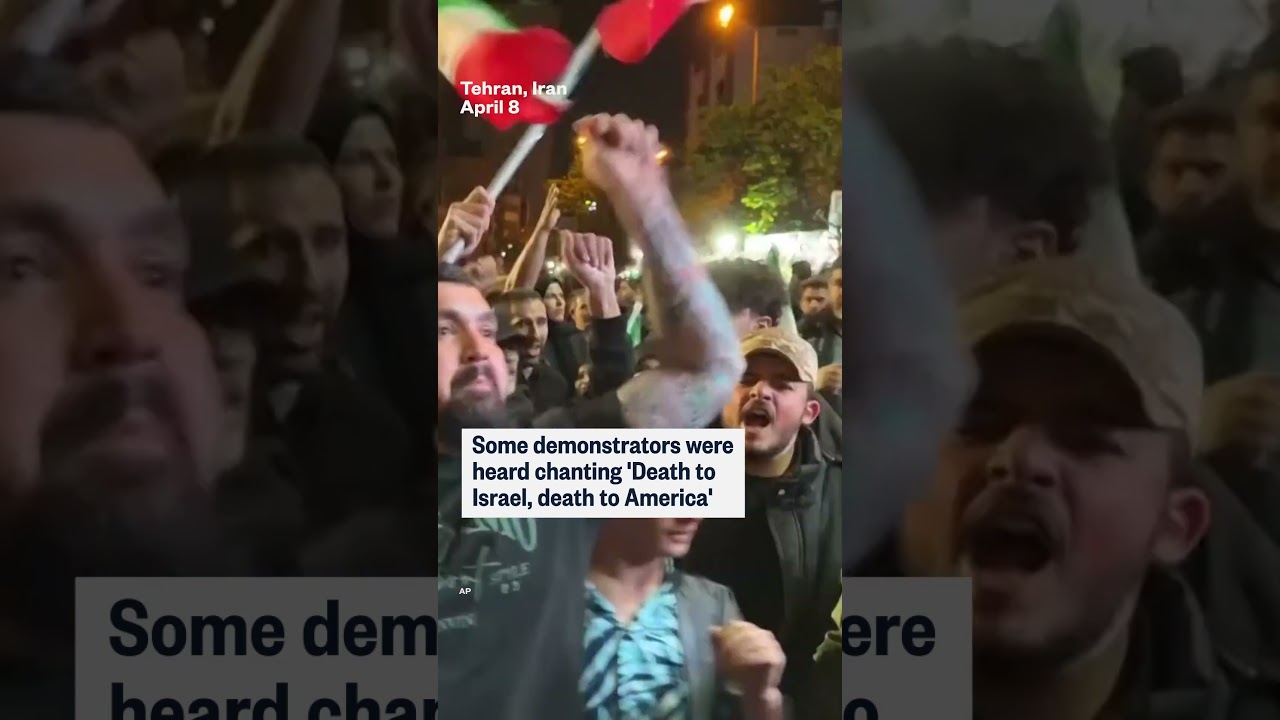 Crowds set fire to U.S. and Israeli flags in Tehran