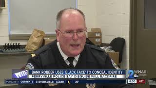 Bank robber uses 'black face' to conceal identity