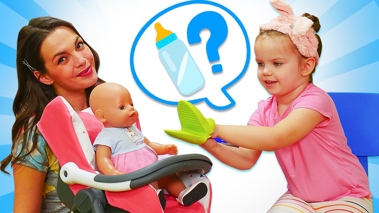 Maya takes care of the baby doll and prepares toy food in a toy kitchen.