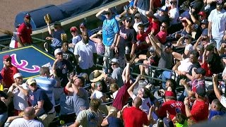 MIA@ATL: Fan makes nice catch during Flowers' at-bat