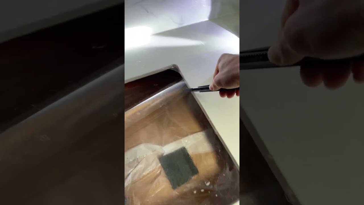 Kitchen countertop film application for quartz stone countertops and kitchen furniture.