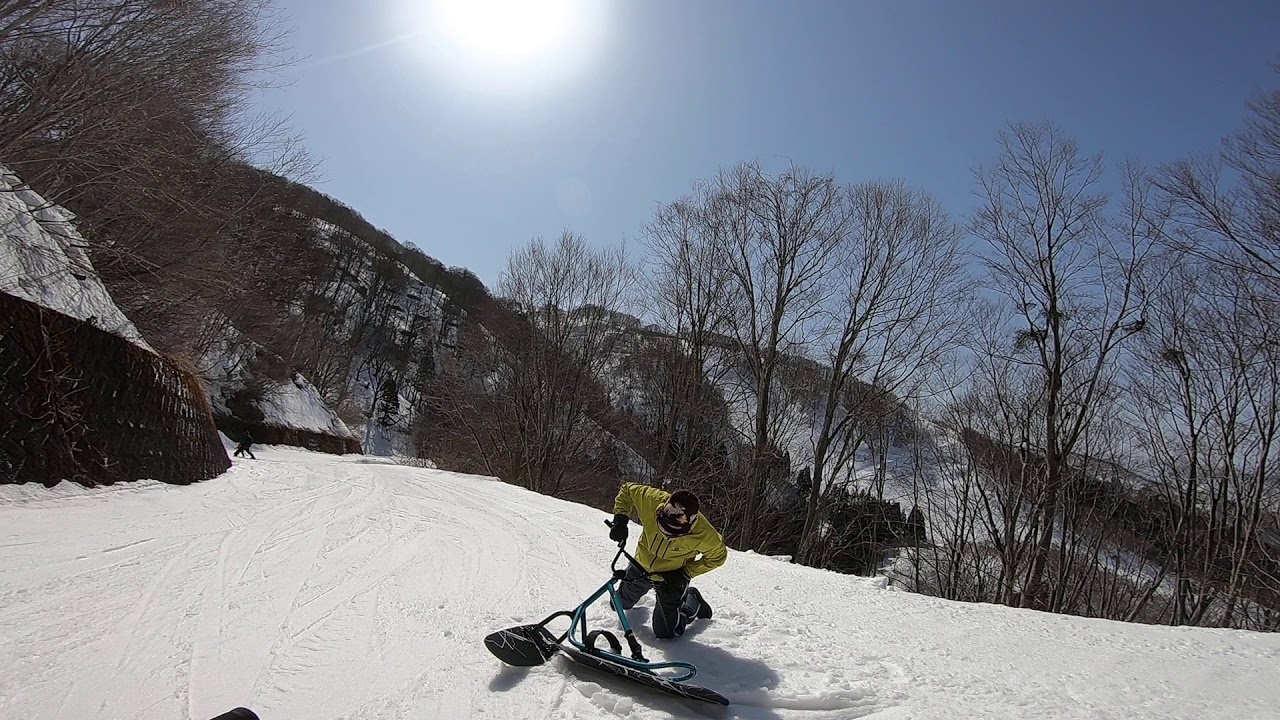 Riding on a snowscoot for the first time!