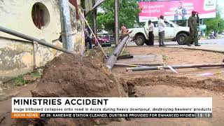 Ministries Accident: A huge billboard collapses onto the road in Accra during a heavy downpour.