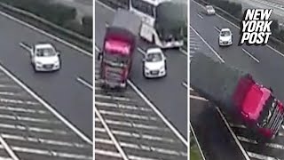 Idiot driver swerves between two lanes causing a truck to topple over