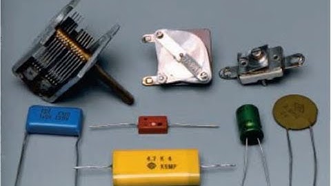 (24-52) When two capacitors are connected in parallel and then connected to a battery, the total sto