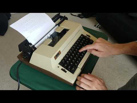 Typing on a vintage Montgomery Ward electric typewriter
