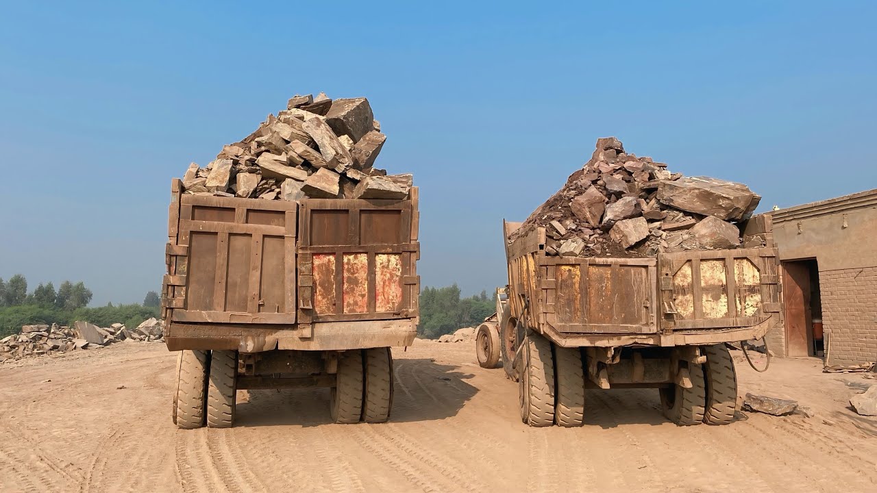 Both trolleys are waiting, fully loaded with stones. There is a lot of weight on the tires.