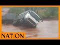 A lorry crossing the flooded Gituma River in Tharaka gets stuck halfway. image