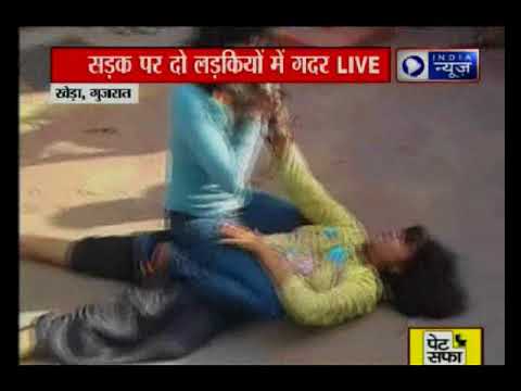 Gujarat Two girls quarrel on the road crowd remains spectators