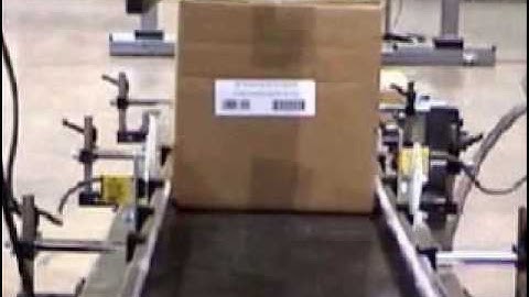 Label Printer Applicator applying labels to the front and back panels of a box