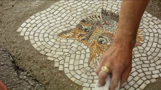 Artist's mosaics fill potholes with actual street art