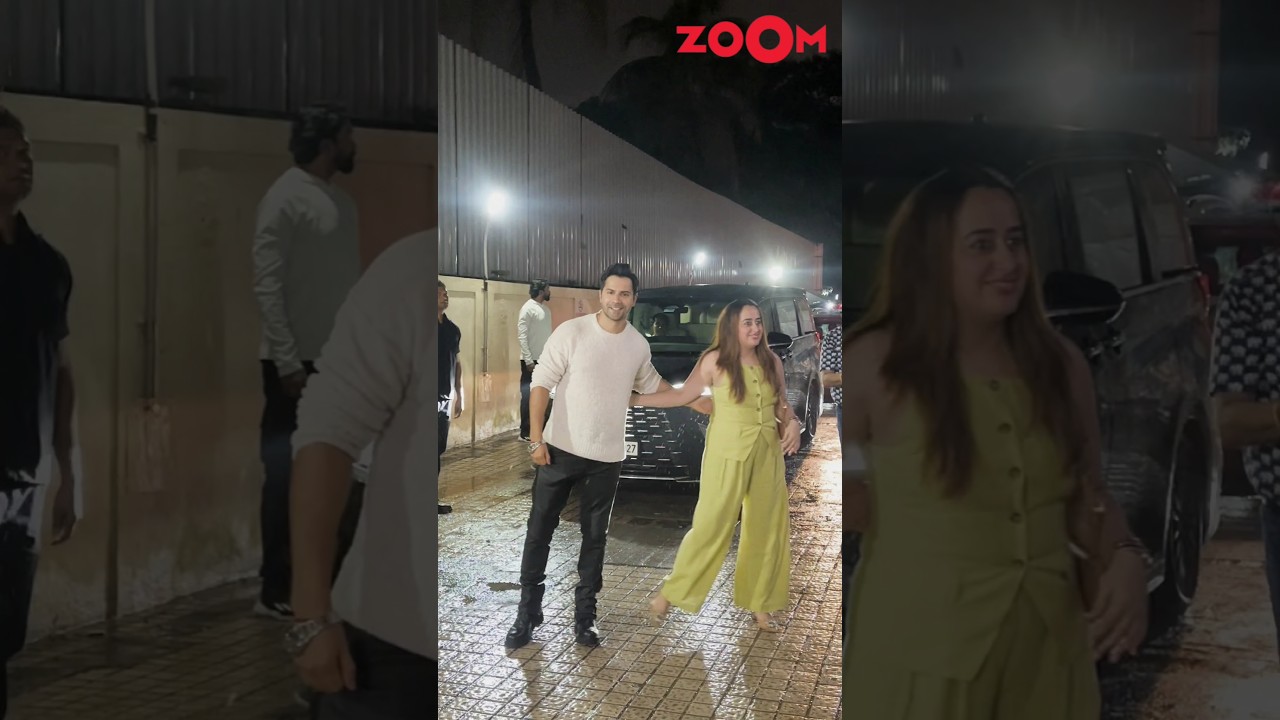 Varun Dhawan POSES for paps while his wife Natasha shyly walks away 😱 