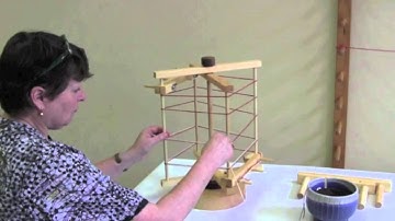 What is the difference between a warping board and a warping reel?