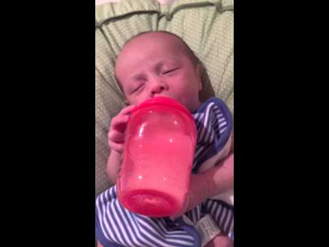 Holding my own bottle at 1 month old!