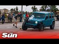 Jeep mows into Black Lives Matter march before protester fires gun, injuring two people in Colorado