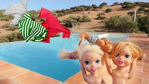 Elsa and Anna toddlers windy day at the swimming pool- floats and towels fly away!