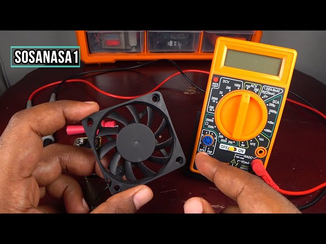 digital multimeter testing 12V DC fan wire portable ice maker