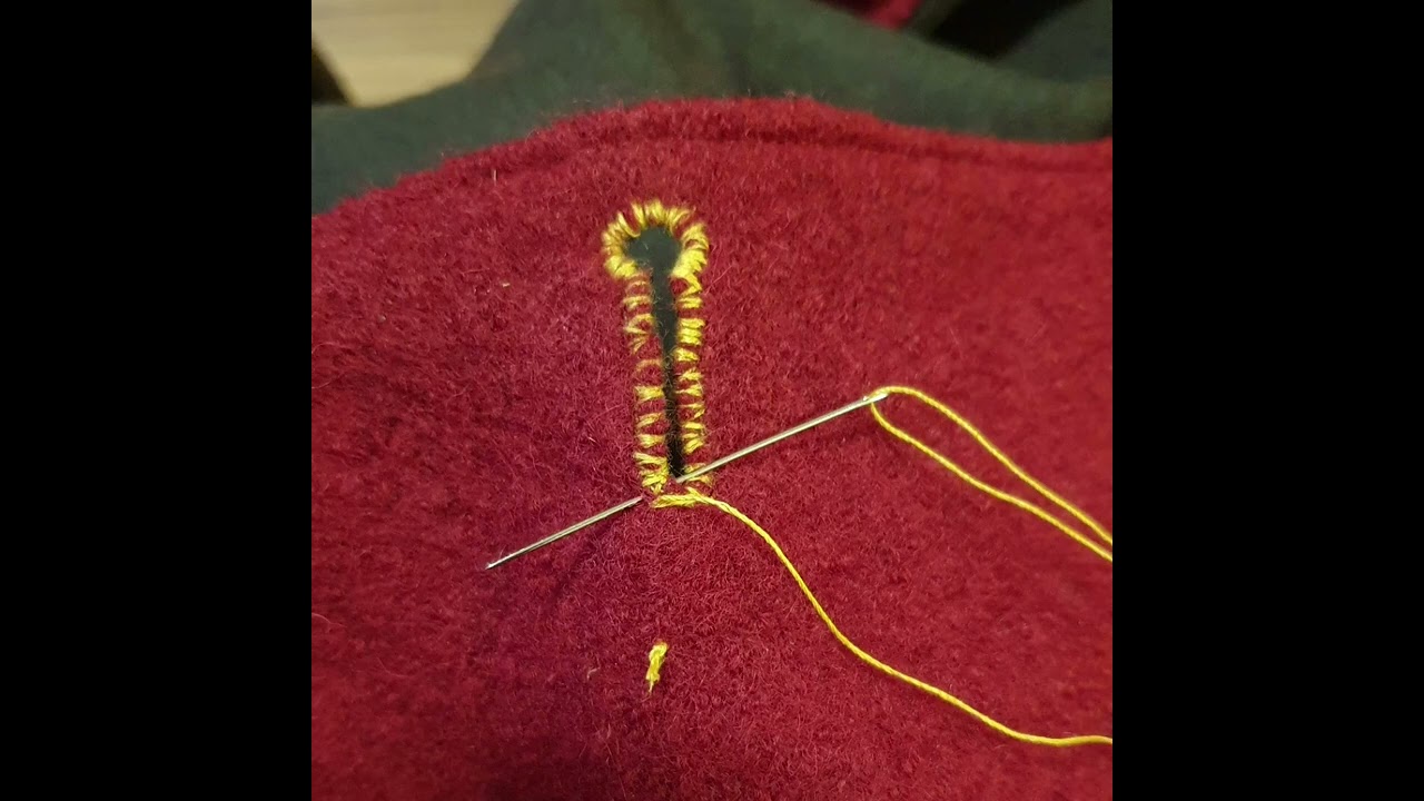 Schneiderknopfloch per Hand genäht