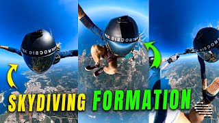 Four Skydivers Forming a Formation While Descending