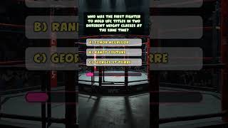 Who Made UFC History with Two Belts? 🏆🔥 #UFCTrivia