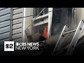Contractor charged after fire rips through 4 homes in Queens