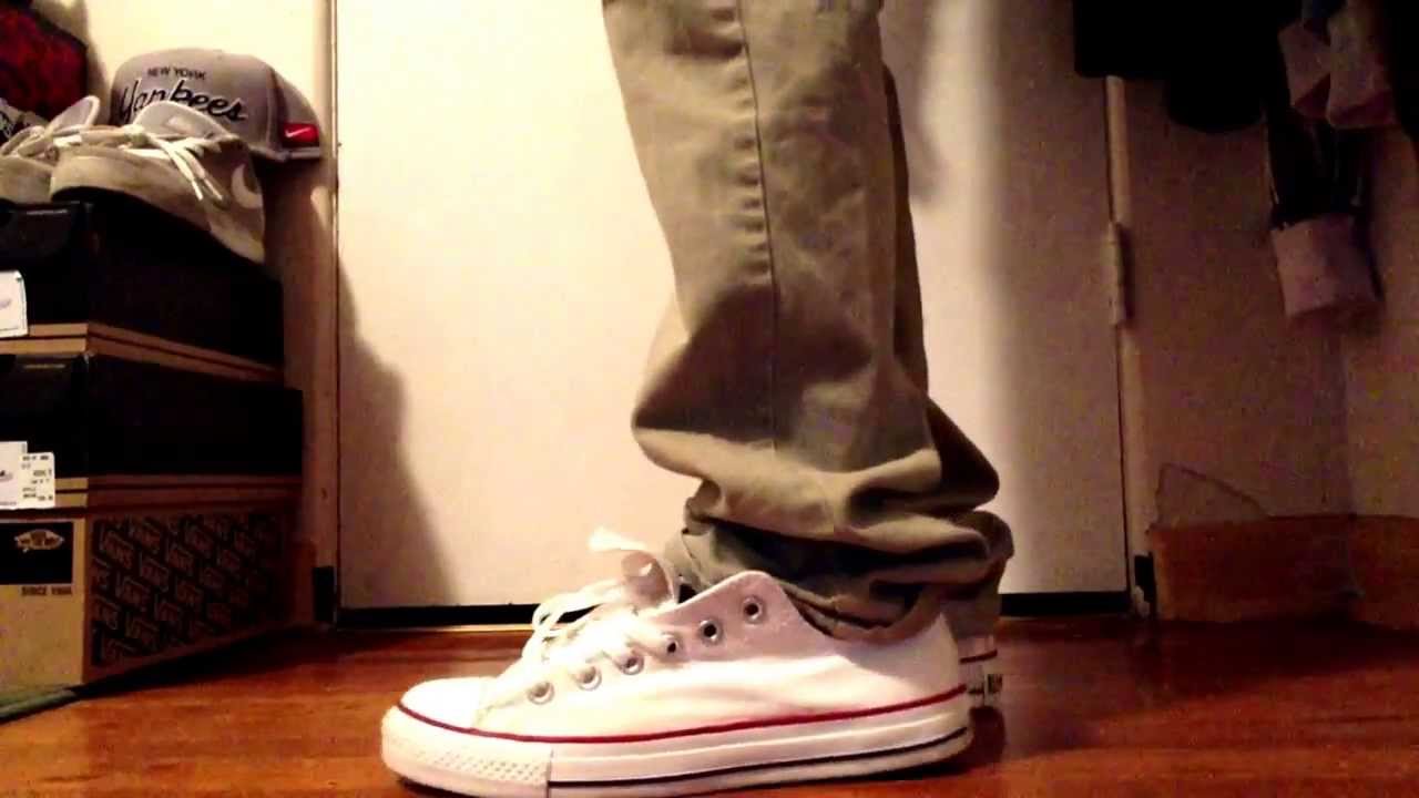 all white converse on feet