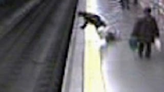 Fainting woman falls on train tracks
