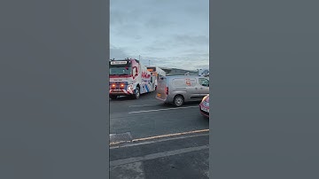Bus goes under low bridge all the way till it
