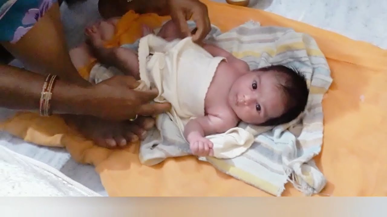 Newborn baby Ghee massage Indian Traditional massage cute baby