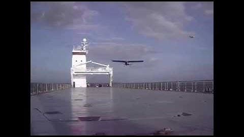 Extreme small plane landing on a ship at sea - part 2