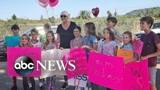 Students ring bells outside teacher's home on her final day of chemo