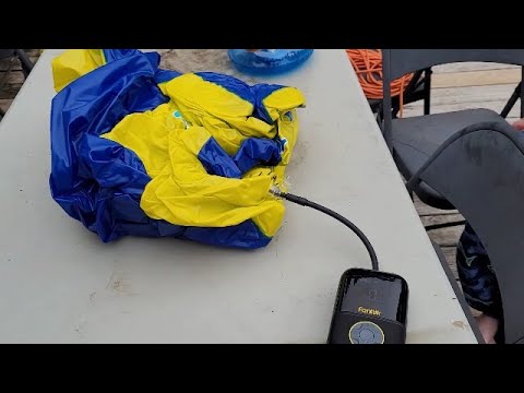 Using portable air compressor to air up pool toy