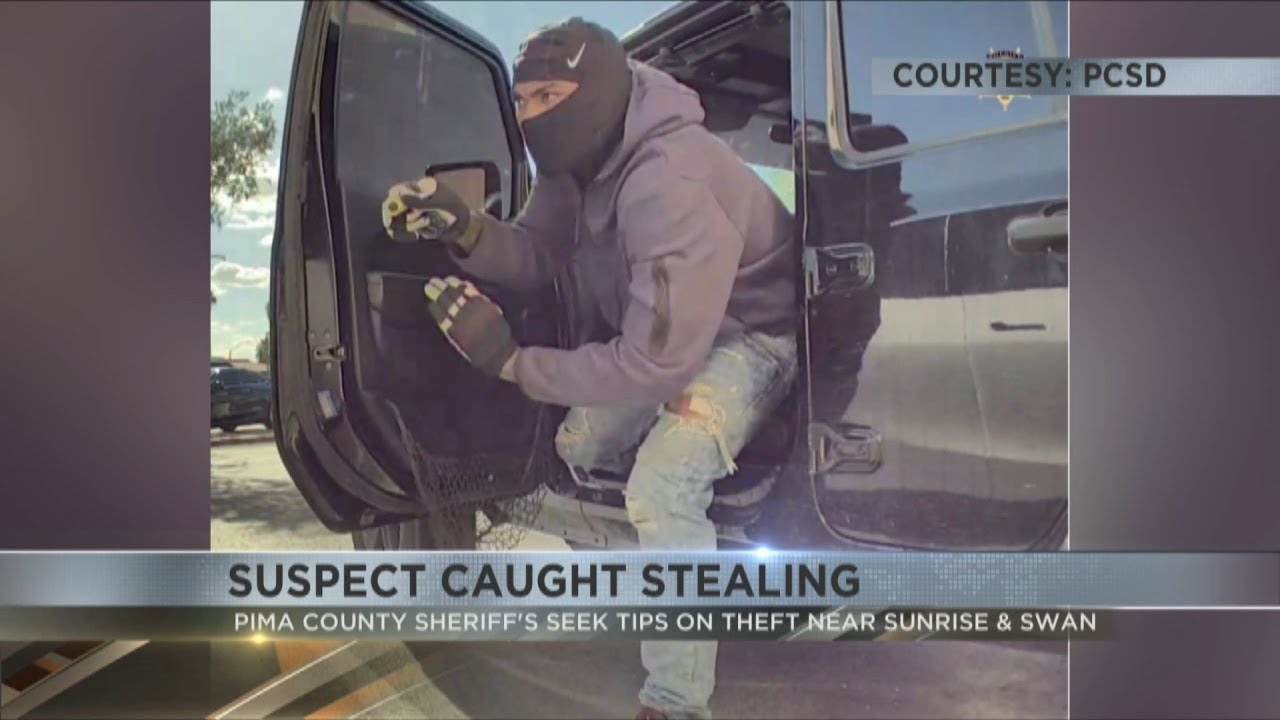 Masked man breaks into car at Tucson shopping center, Tesla camera captures incident