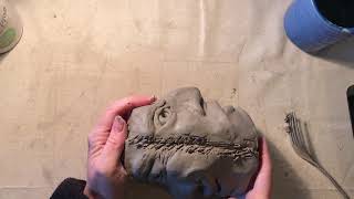 Joining the two faces together to make the vase shape
