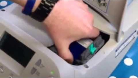 How to install a cartridge on a Pitney Bowes DM100 Franking Machine