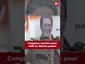 Watch  congress workers pour milk on sonia gandhis poster in telangana