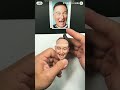 Statue of a laughing man. Which one of you laughs like this?