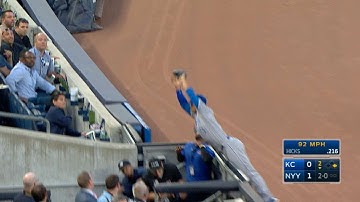 Cuthbert teeters on railing to make the catch