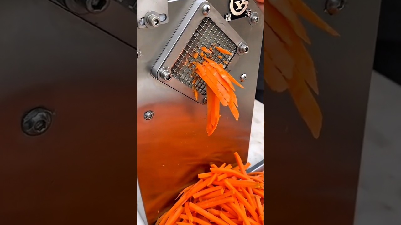 commercial machine efficiently slices fresh carrots into perfect strips