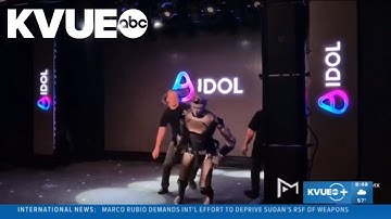 Russian AI robot falls on stage during debut