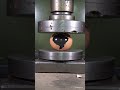 Hydraulic press crushes eggs with black ink